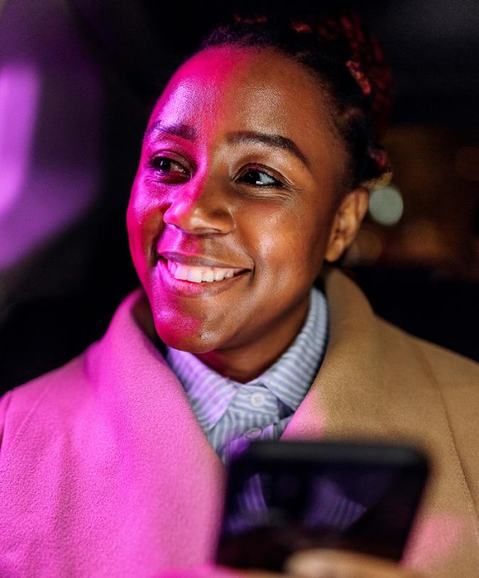 A smiling woman with a phone